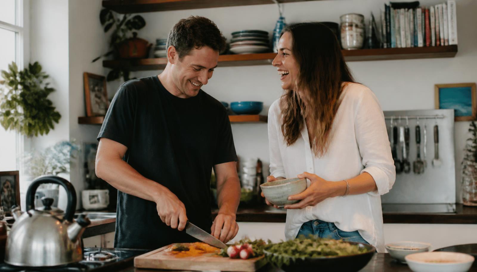 Couple cooking together in their shared home